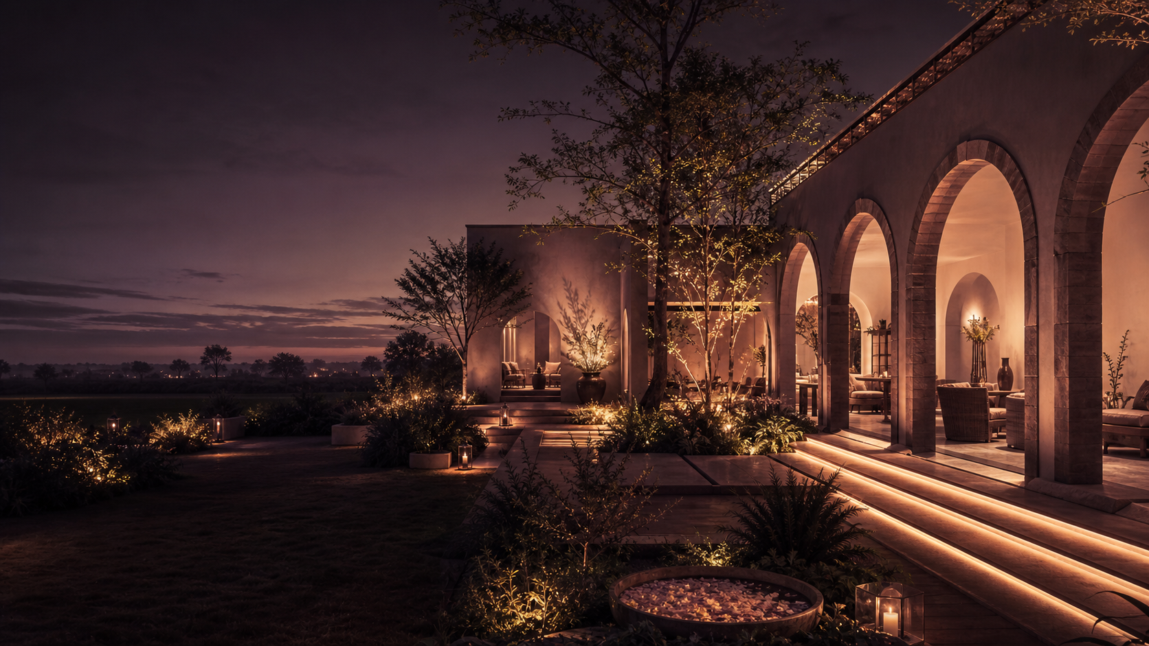 A contemporary Indian hospitality property illuminated at twilight